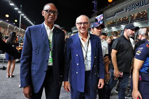Rwandan President Paul Kagame and Formula 1 chief Stefano Domenicali at a racing circuit.